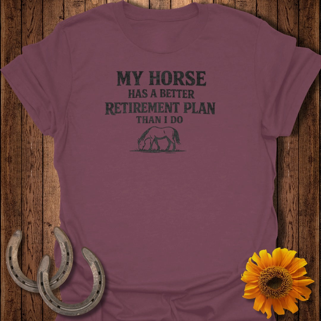 Maroon t-shirt with text "MY HORSE HAS A BETTER RETIREMENT PLAN THAN I DO" and horse graphic.