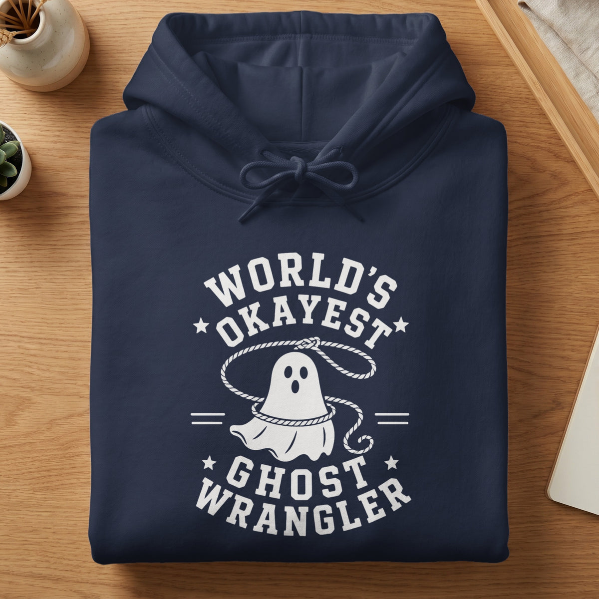 Navy hoodie with "World's Okayest Ghost Wrangler" text and a ghost graphic.