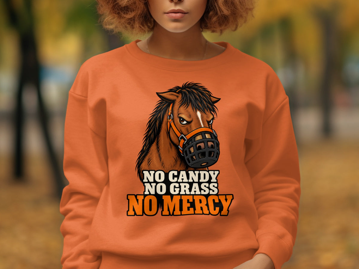 Orange sweatshirt with a horse wearing a muzzle and the text "NO CANDY NO GRASS NO MERCY".