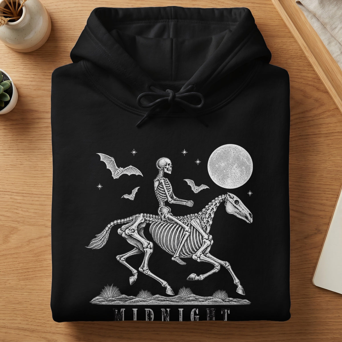 Black hoodie with skeleton riding a horse under a full moon and bats.