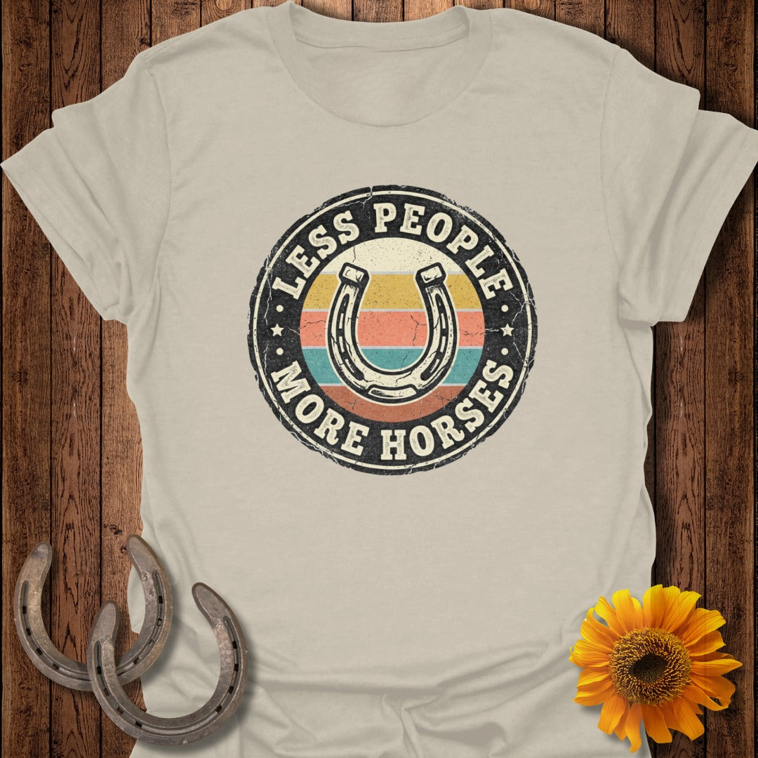 "Less People More Horses" text with horseshoe and rainbow stripes on a t-shirt.