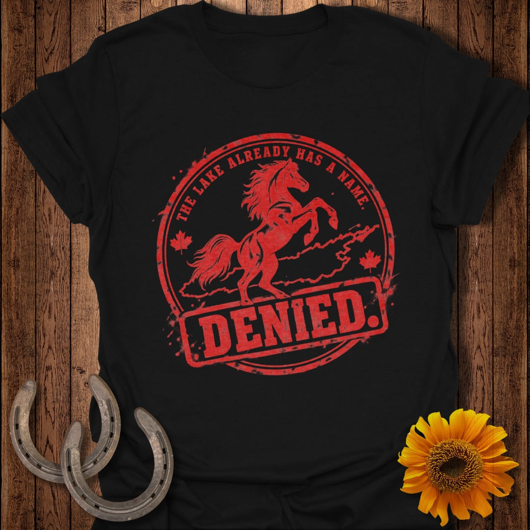 Black t-shirt with red distressed graphic of a rearing horse, Canadian maple leaves, and text "THE LAKE ALREADY HAS A NAME. DENIED."