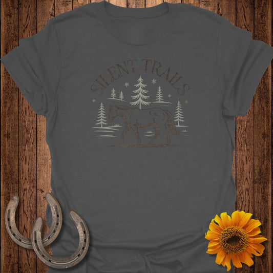 T-shirt with "Silent Trails" text, horse and trees graphic, on a dark gray shirt.