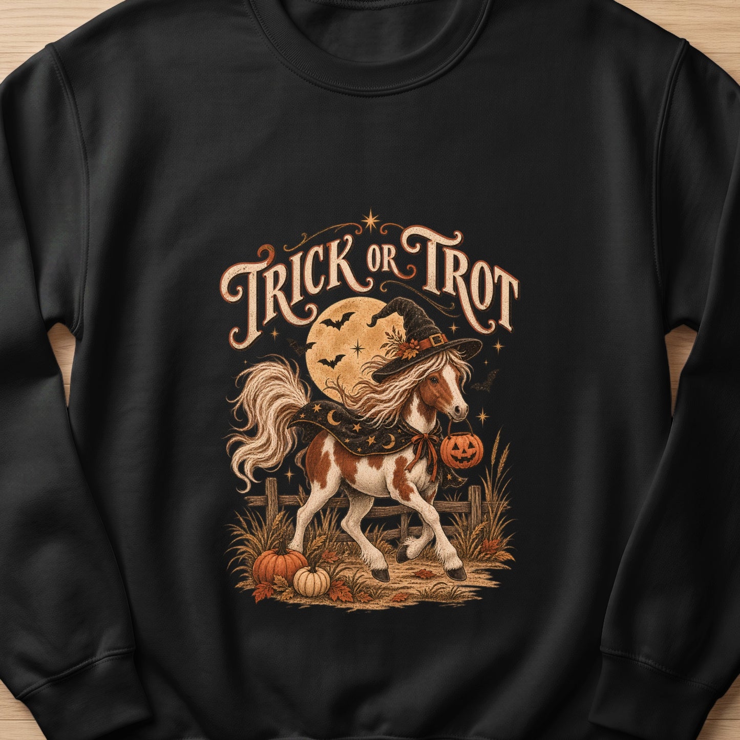 Pinto horse wearing witch hat and carrying pumpkin with "Trick or Trot" text.