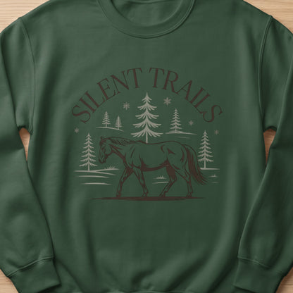 Dark green sweatshirt with a horse, trees, and "Silent Trails" text graphic.
