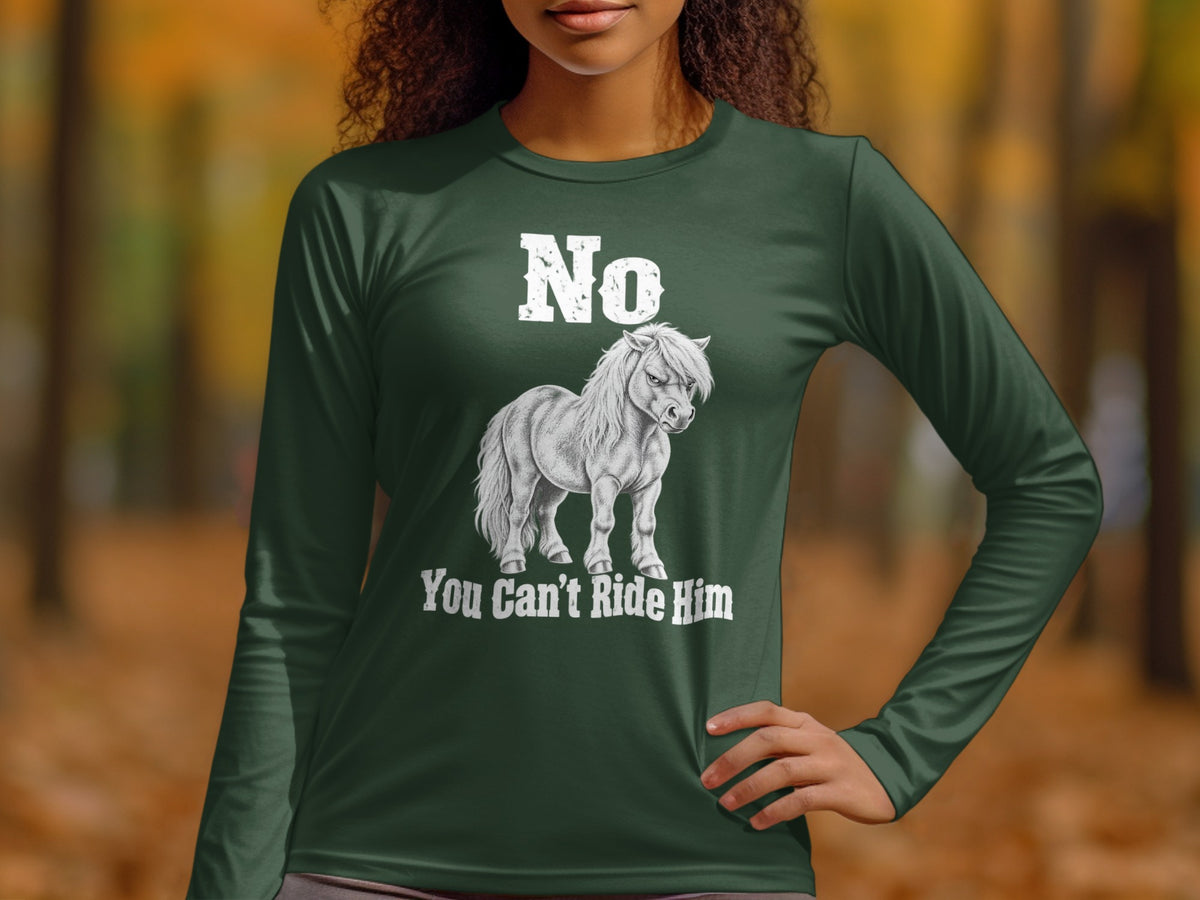 A person wearing a dark green long-sleeve shirt with a graphic of a grumpy pony and text reading "No You Can't Ride Him".