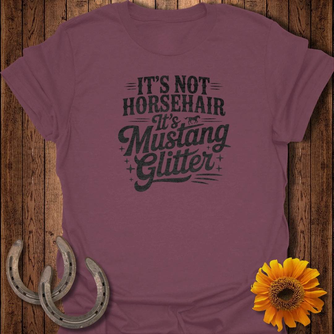 Maroon t-shirt with "It's Not Horsehair, It's Mustang Glitter" text.