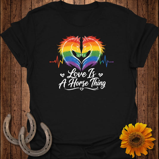 Black t-shirt with two horses and rainbow heart, "Love Is A Horse Thing" text.