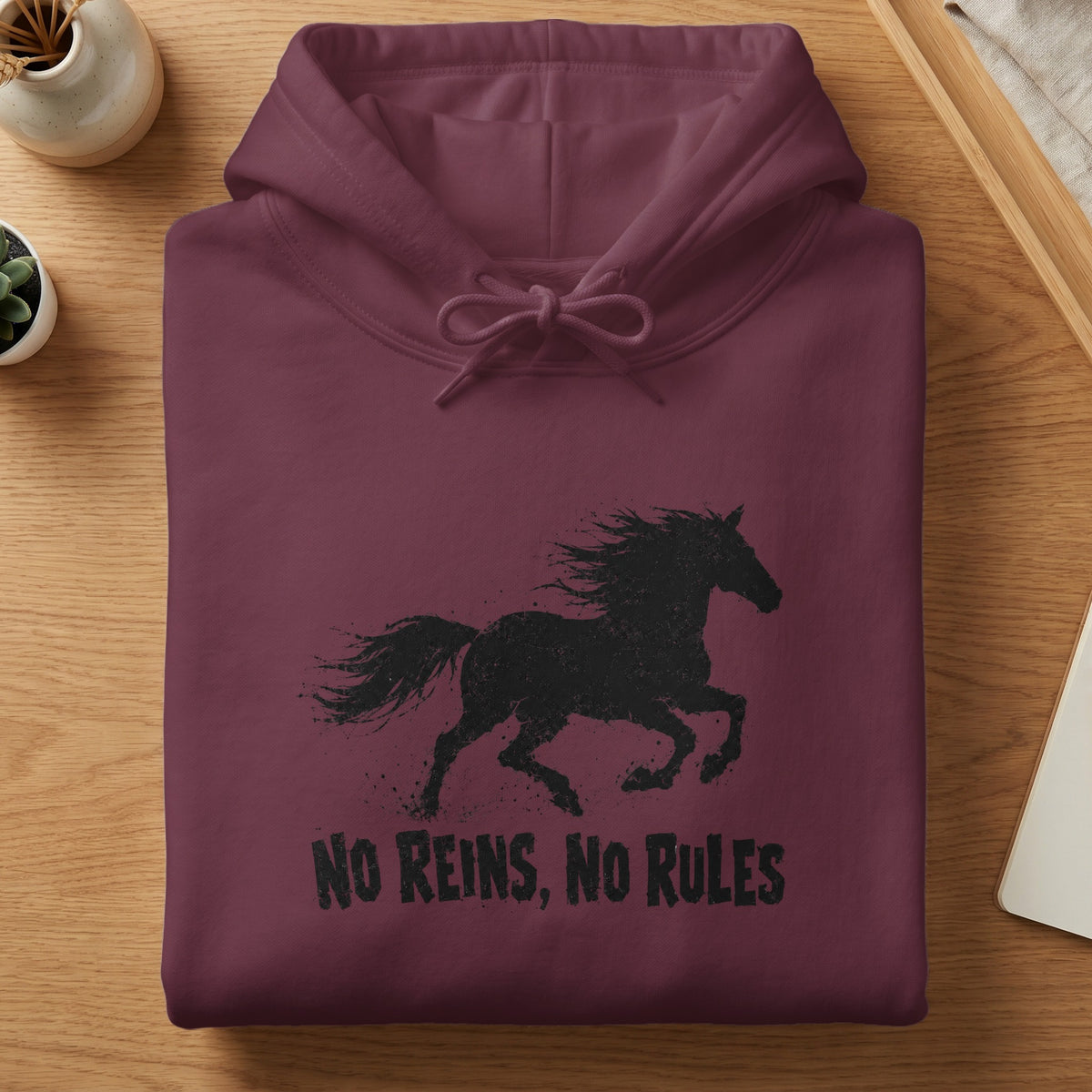 Burgundy hoodie with a black distressed silhouette of a running horse and "No Reins, No Rules" text.