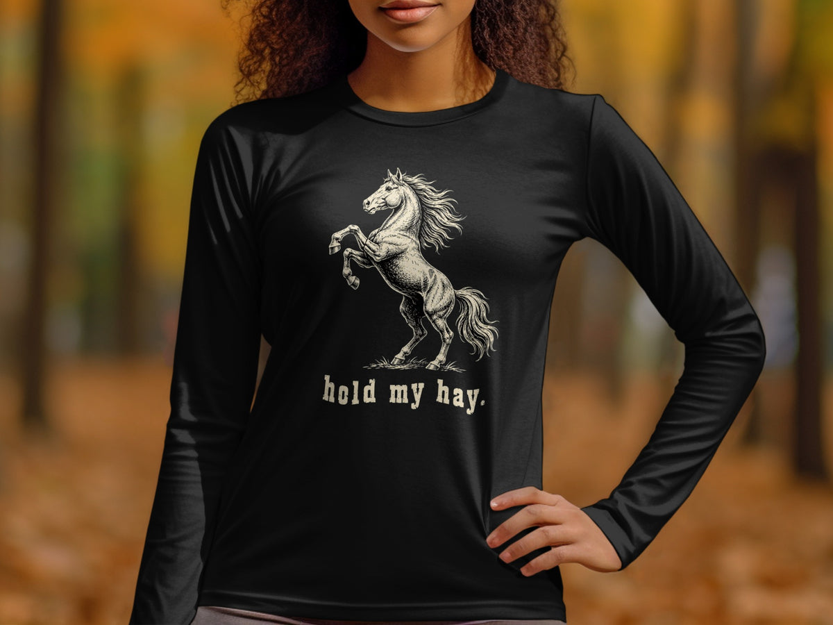 Black long-sleeve shirt with a rearing horse graphic and "hold my hay." text.