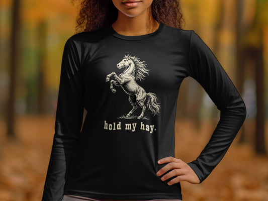 Black long-sleeve shirt with a rearing horse graphic and "hold my hay." text.