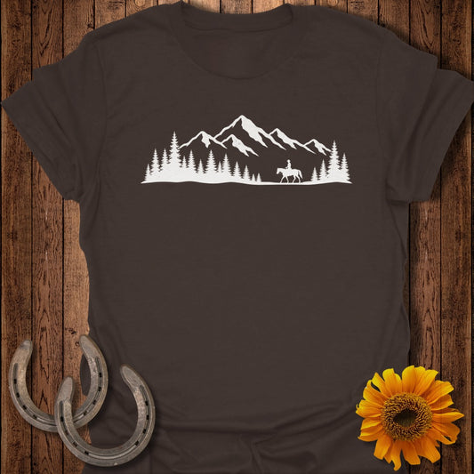 Brown t-shirt with white silhouette of rider on horseback before mountains and trees.