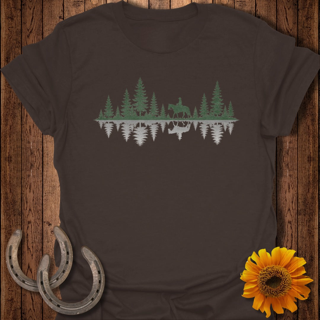 Brown t-shirt with a silhouette of a rider on a horse in a forest, reflected in water.