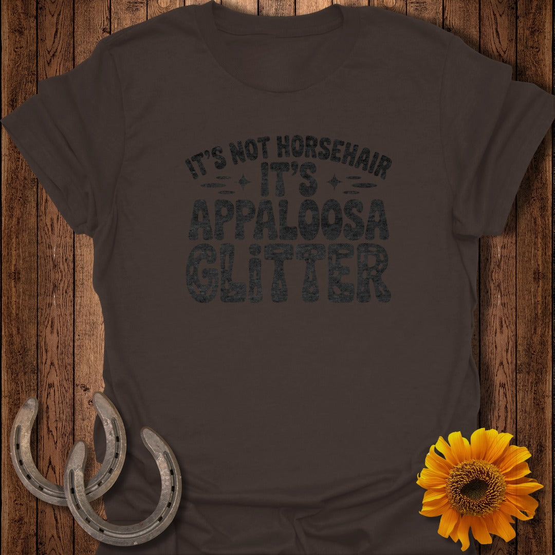 Dark brown t-shirt with "It's Not Horsehair, It's Appaloosa Glitter" text.