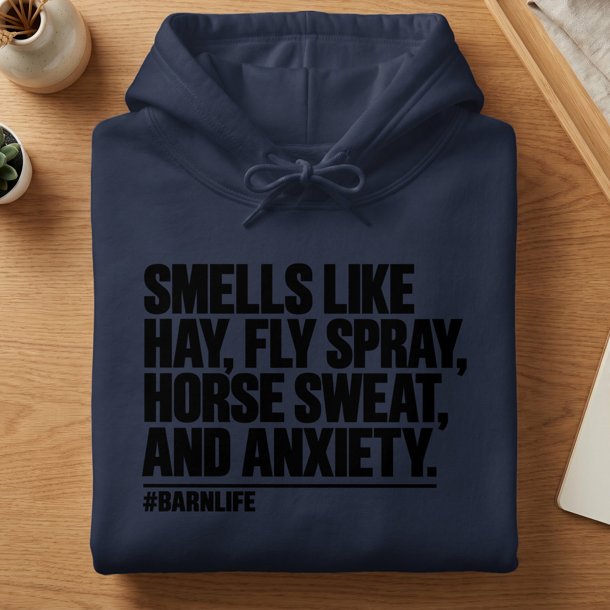 Navy hoodie with black text "Sells Like Hay, Fly Spray, Horse Sweat, and Anxiety. #Barnlife."