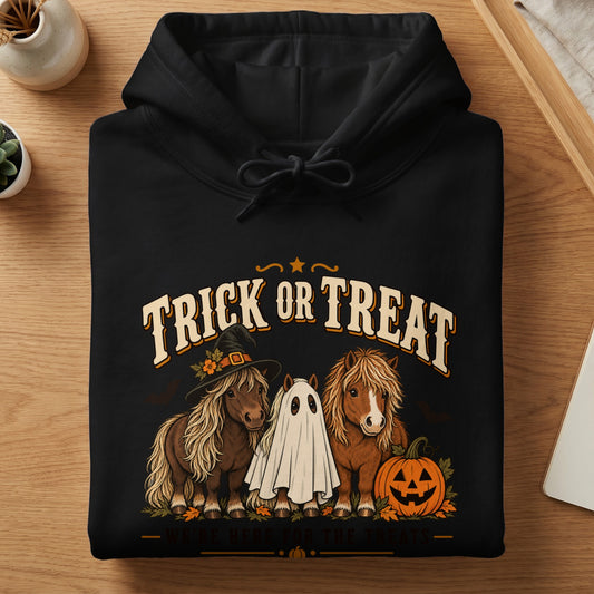 Black hoodie with "Trick or Treat" text, ponies in Halloween costumes, and a pumpkin.