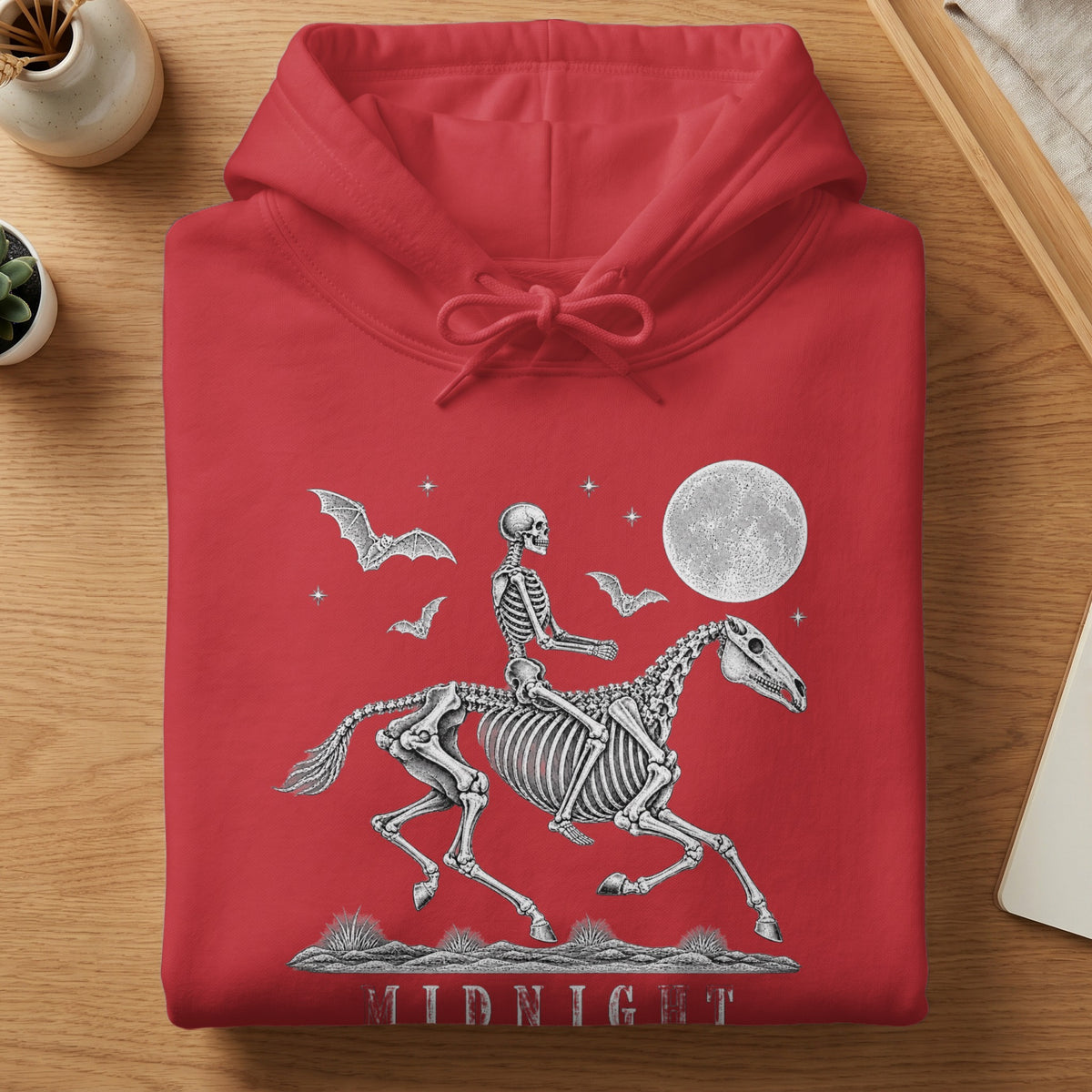 Red hoodie with skeleton riding a horse graphic, bats, moon, and "MIDNIGHT" text.