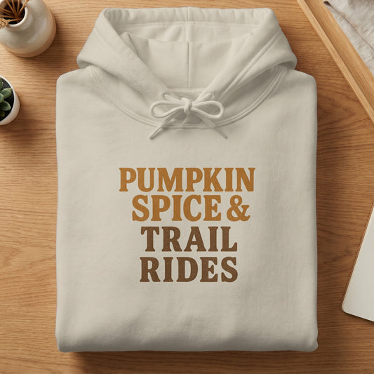 Cream hoodie with "Pumpkin Spice & Trail Rides" text in brown.