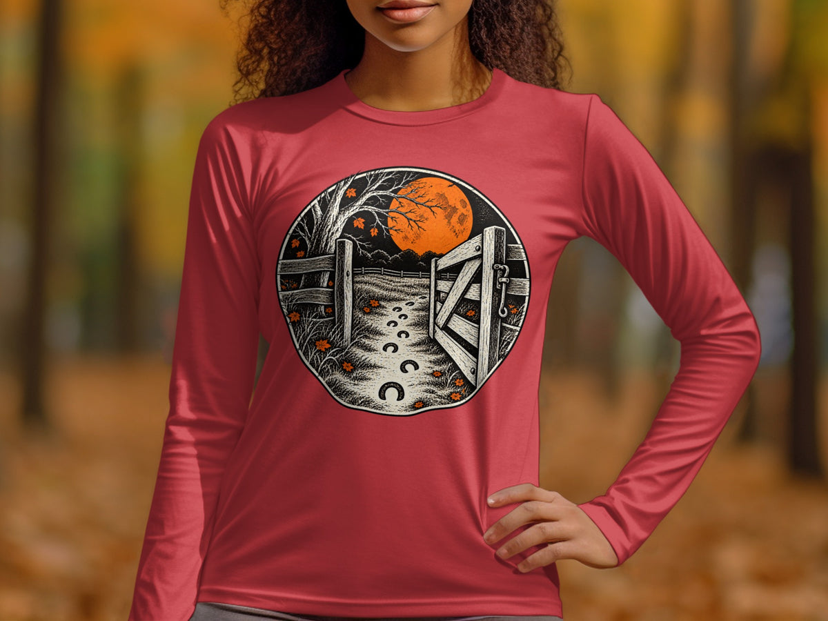 Circular graphic of a gateway, horseshoe path, and moon on a long-sleeve shirt.