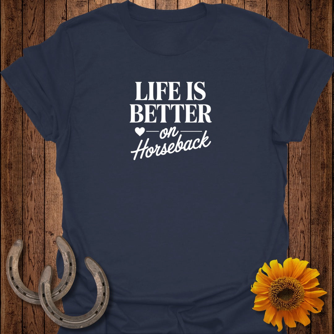 Navy t-shirt with "Life is better on horseback" text, horseshoes, and sunflower.