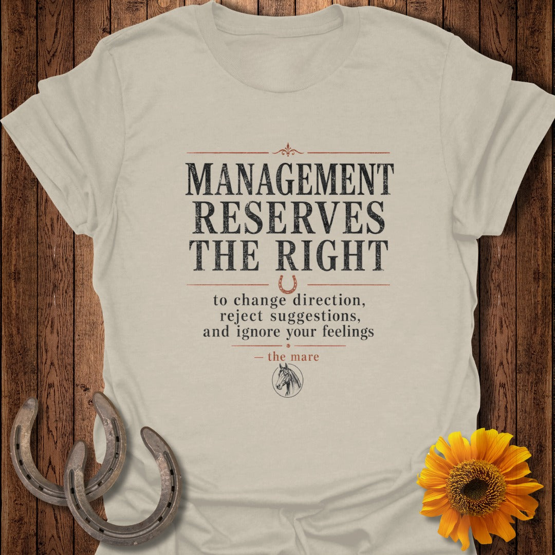 Cream t-shirt with text "MANAGEMENT RESERVES THE RIGHT to change direction, reject suggestions, and ignore your feelings—the mare".