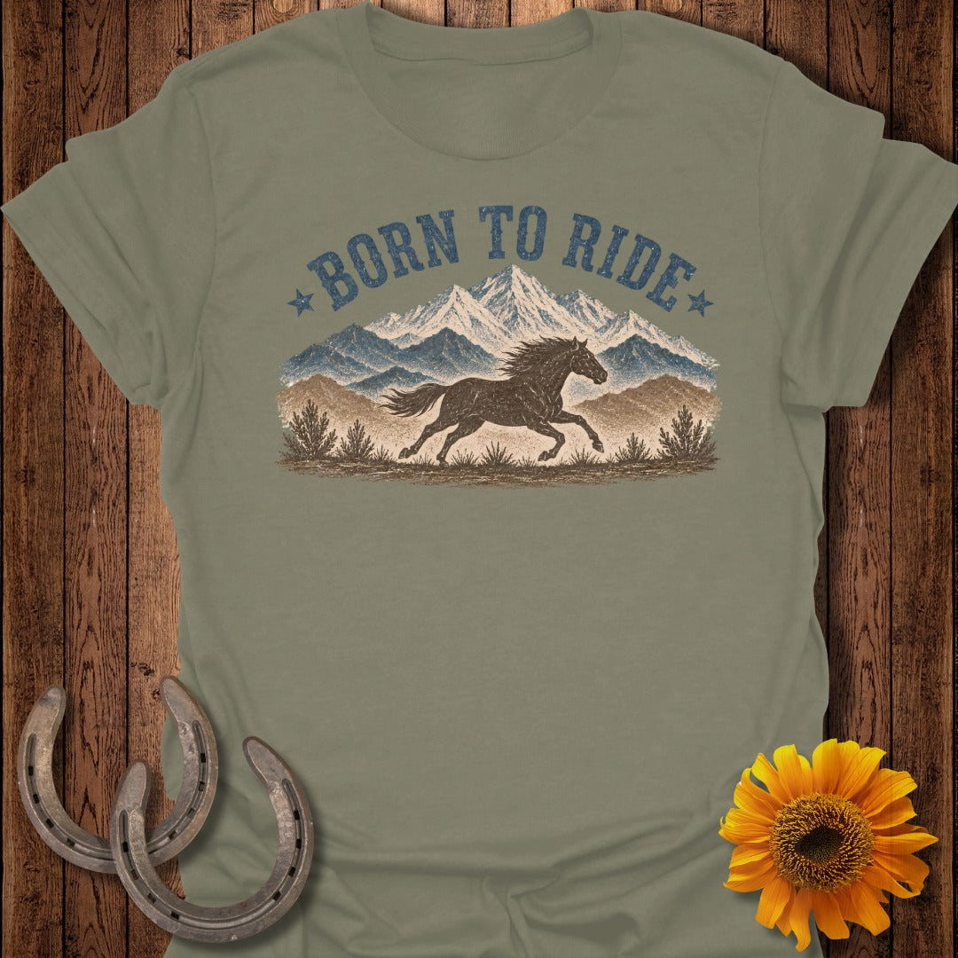 Green t-shirt with "Born to Ride" text and running horse graphic over mountains.