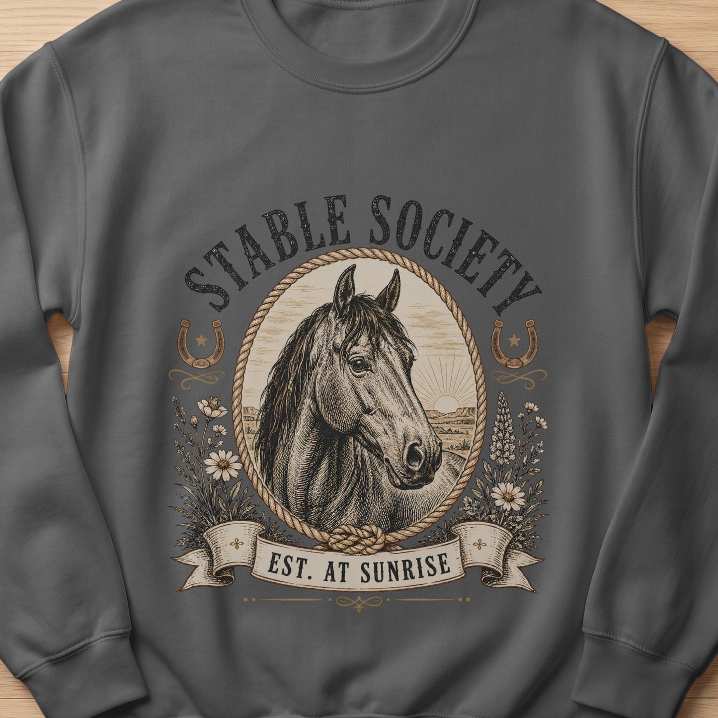Dark grey sweatshirt with "STABLE SOCIETY EST. AT SUNRISE" and horse illustration.
