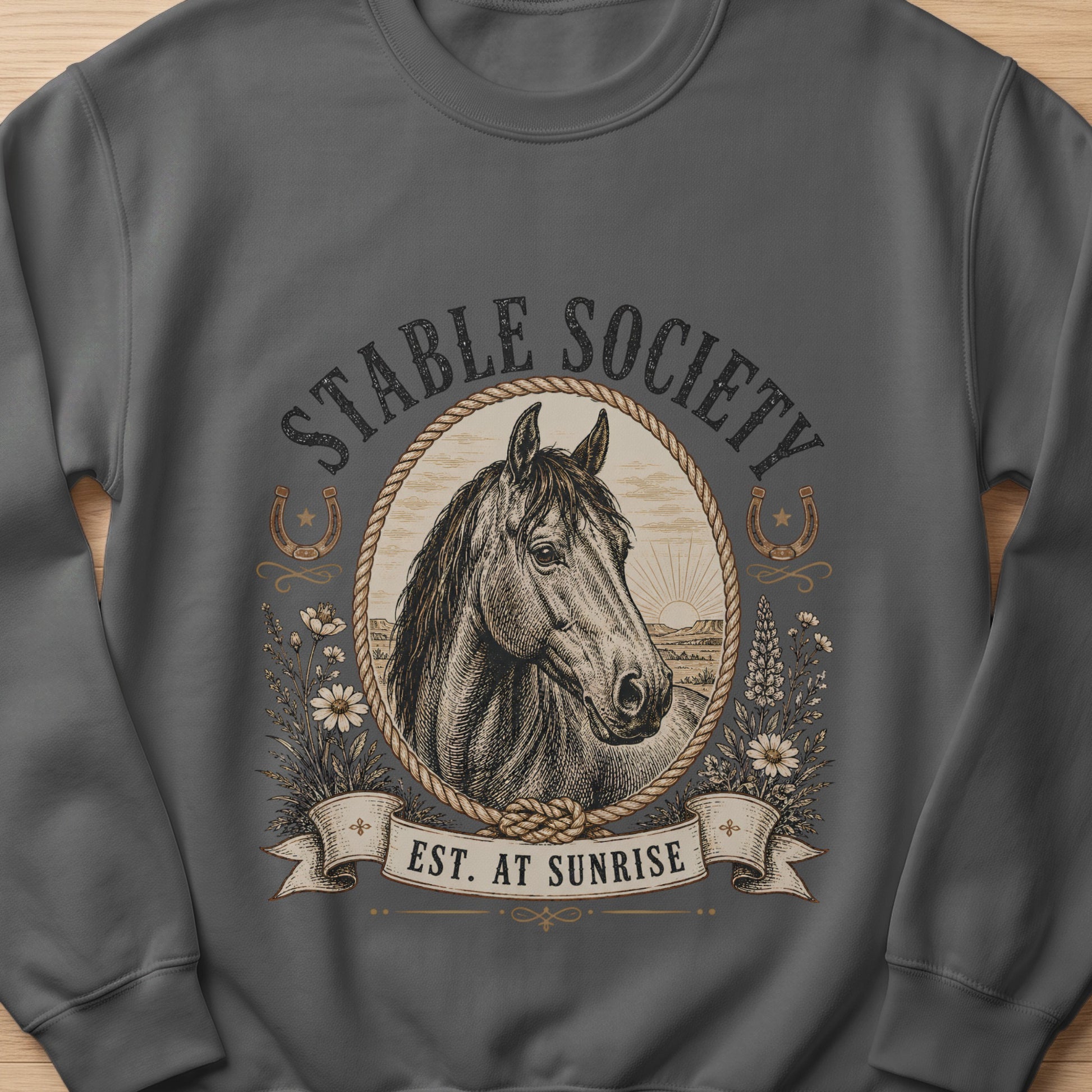 Dark grey sweatshirt with "STABLE SOCIETY EST. AT SUNRISE" and horse illustration.