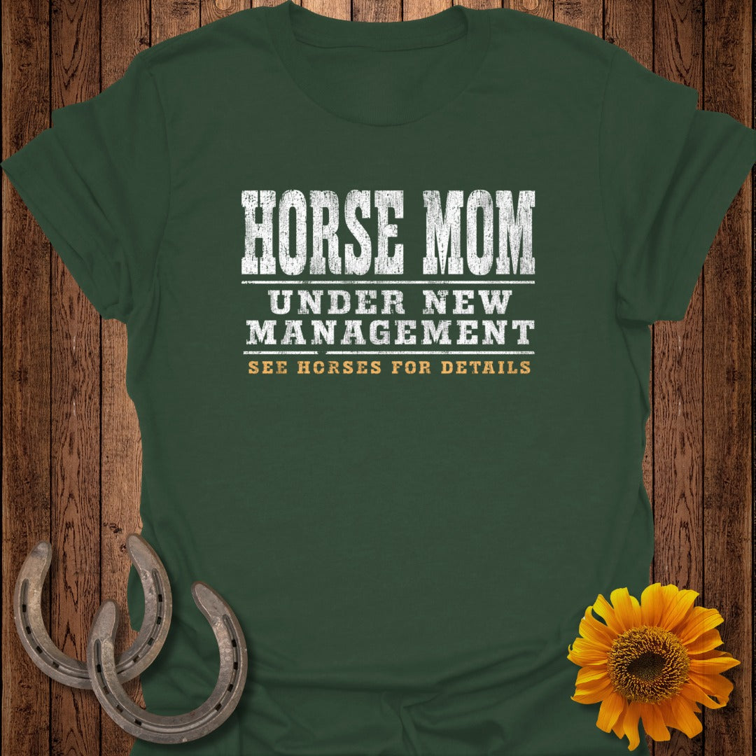 Green t-shirt with "HORSE MOM UNDER NEW MANAGEMENT SEE HORSES FOR DETAILS" text.