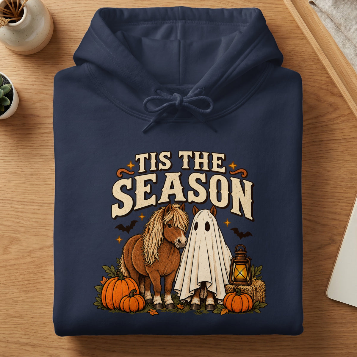 Navy hoodie with "Tis The Season" text, a pony, and a ghost.