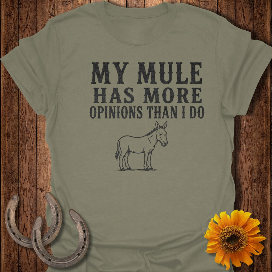 Olive green t-shirt with "MY MULE HAS MORE OPINIONS THAN I DO" text and mule illustration.
