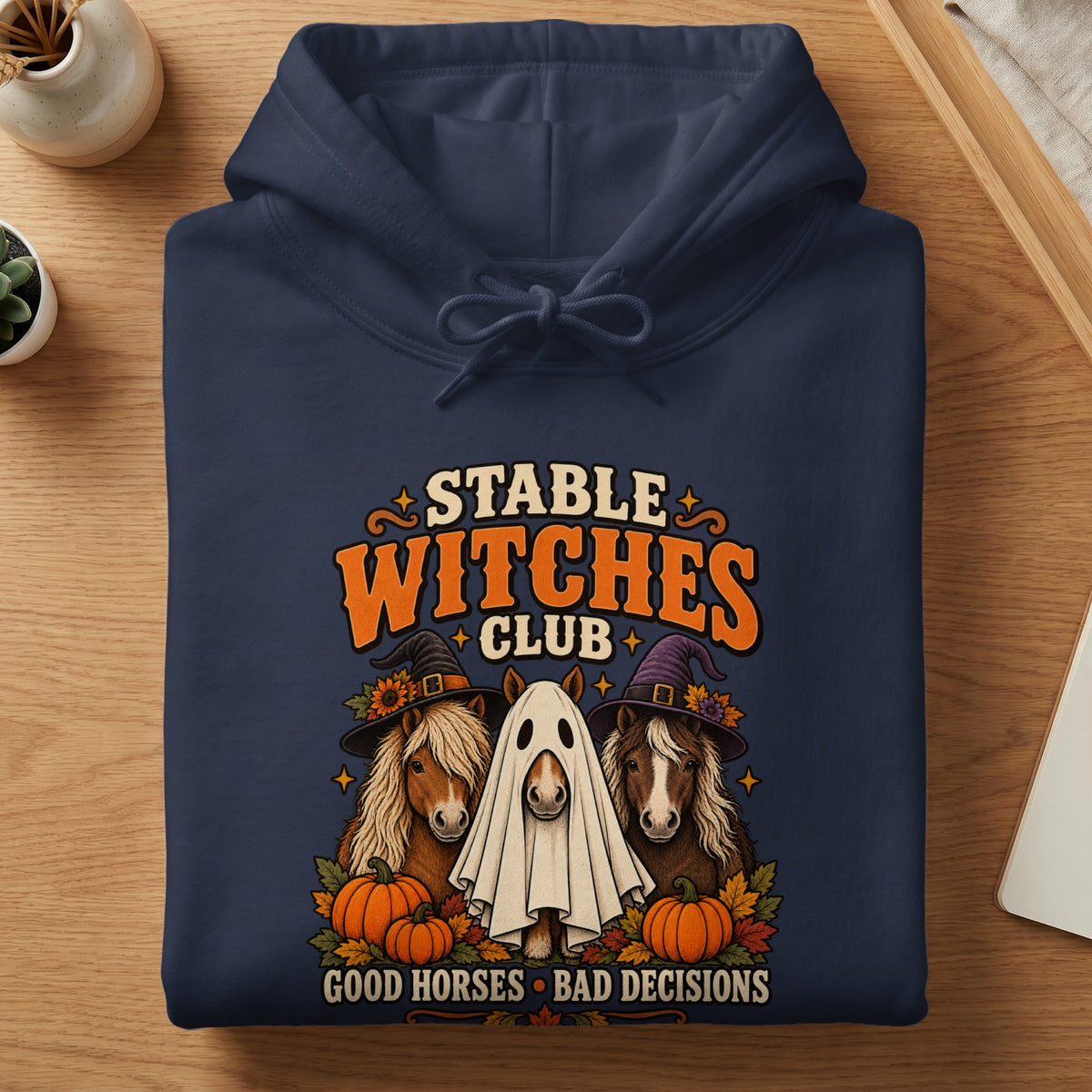 Navy hoodie with "Stable Witches Club" text, horses, pumpkins, and "Good Horses Bad Decisions."
