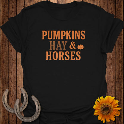 Black t-shirt with text "PUMPKINS HAY & HORSES", horseshoes, and sunflower.