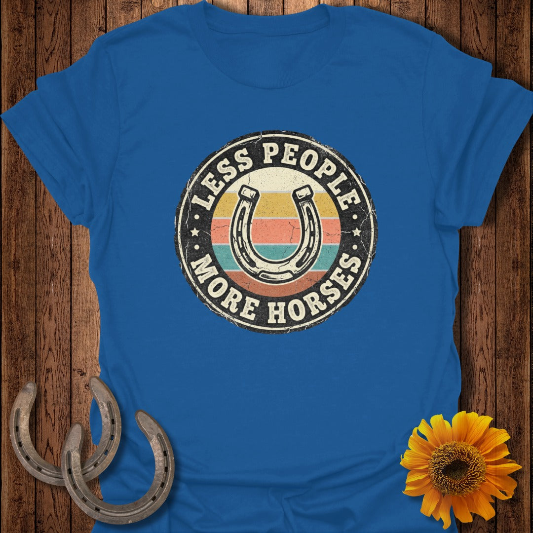 Blue t-shirt with horseshoe and rainbow graphic, "Less People More Horses" text.