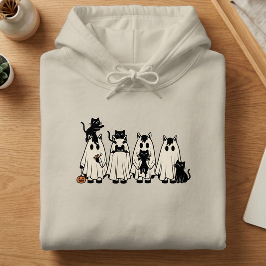 Cream hoodie with black cats dressed as ghosts and horse skeletons.