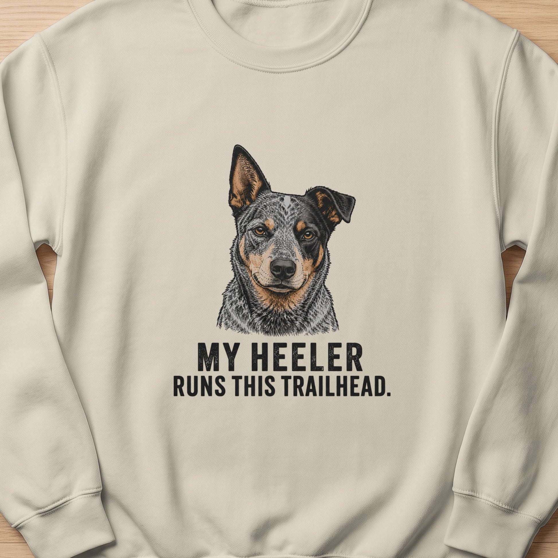 Light cream sweatshirt with a detailed drawing of an Australian Cattle Dog and text.