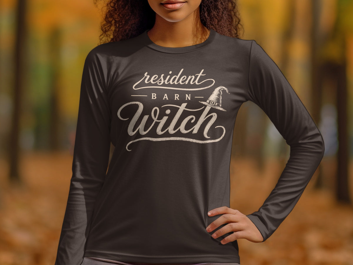 Dark long-sleeve shirt with "resident BARN Witch" and a witch hat graphic.