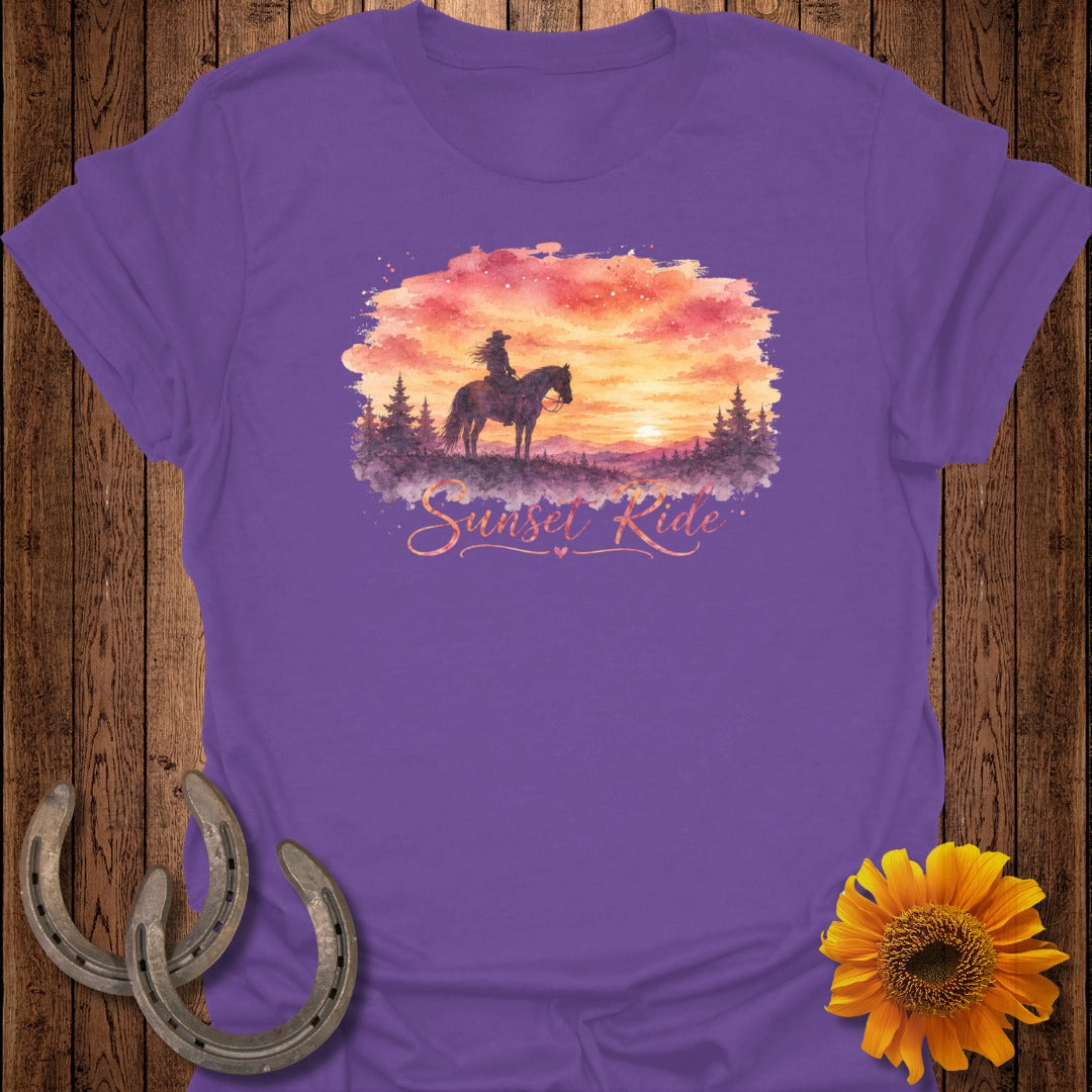 Purple t-shirt with watercolor graphic of a rider on a horse at sunset.