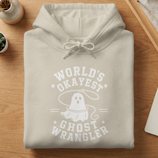 Light beige hoodie with "World's Okayest Ghost Wrangler" graphic and a ghost illustration.