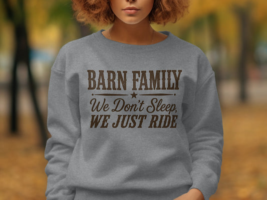 Gray sweatshirt with "Barn Family We Don't Sleep, We Just Ride" text.