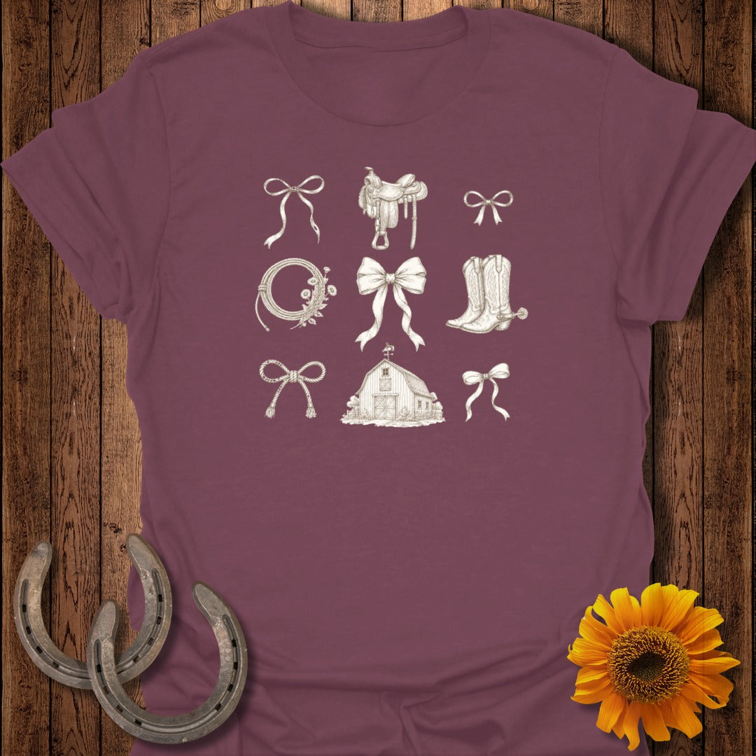 Burgundy t-shirt with line drawings of cowboy boots, bows, barn, and horseshoes.
