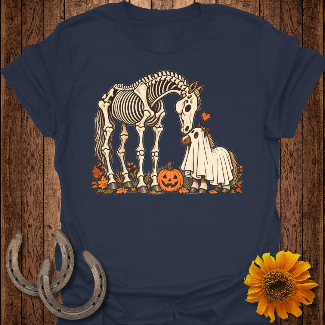 Skeleton horse and a pony in ghost costume with pumpkin and autumn leaves.