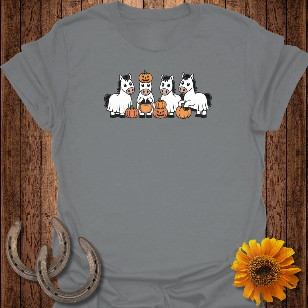 Four cartoon horses dressed as ghosts with pumpkins for Halloween.