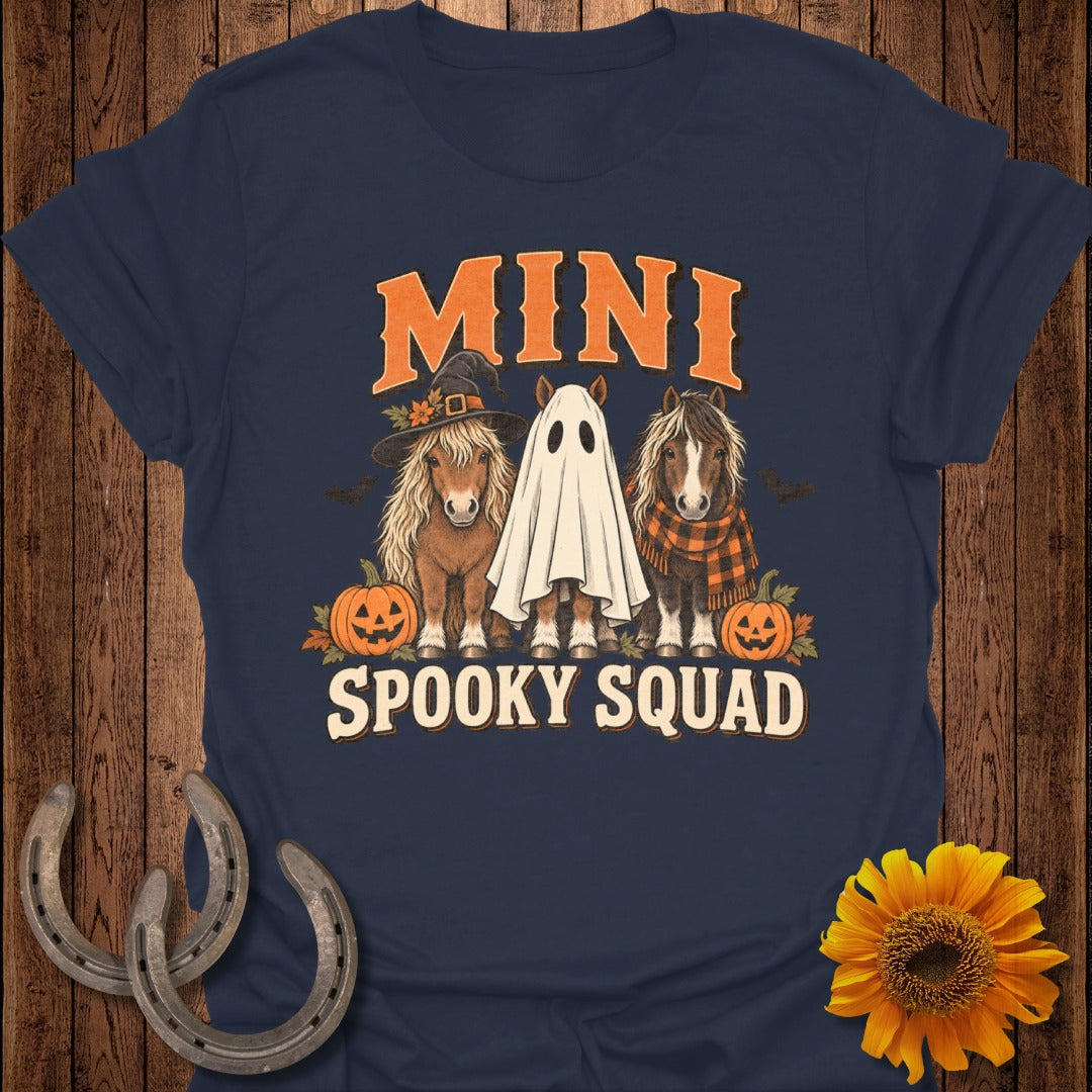 Mini horses dressed for Halloween with pumpkins and text "MINI SPOOKY SQUAD".