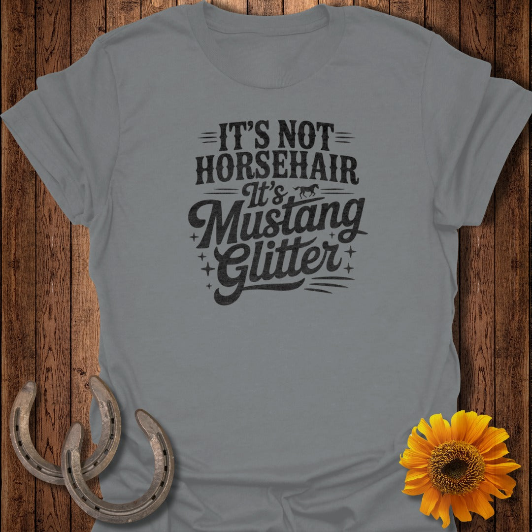 Grey t-shirt with "It's Not Horsehair It's Mustang Glitter" text.
