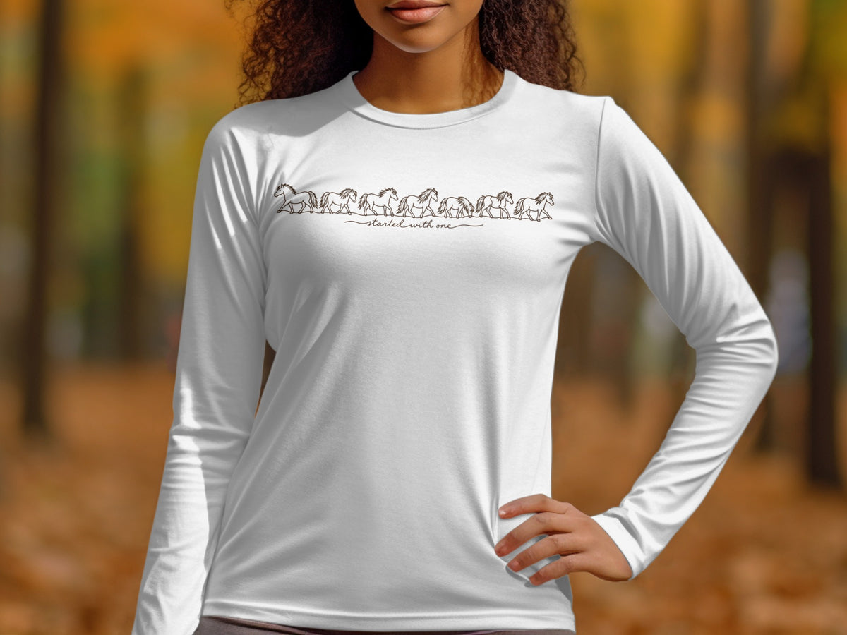 White long sleeve shirt with a line of running horses and "started with one" text.