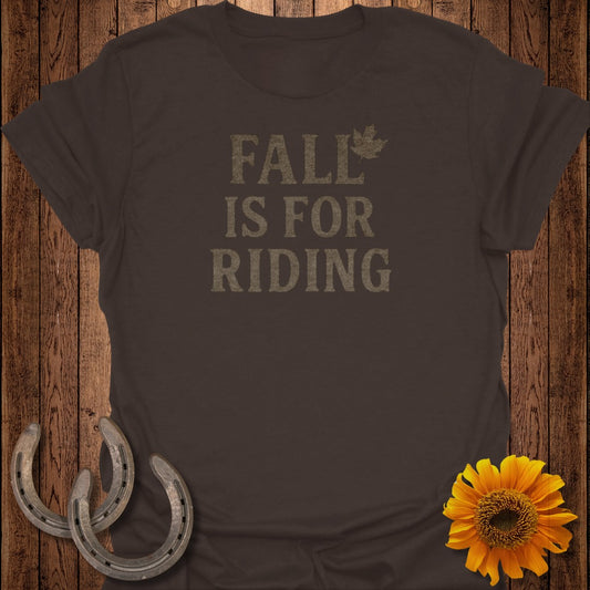 Brown t-shirt with "FALL IS FOR RIDING" text and a maple leaf.