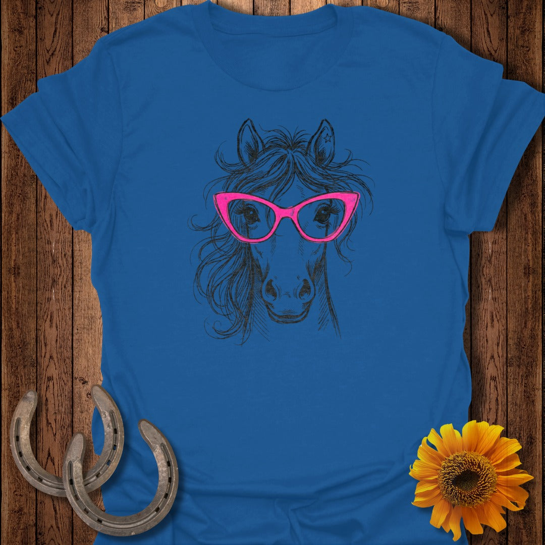 Blue t-shirt with sketch of a horse wearing pink glasses.