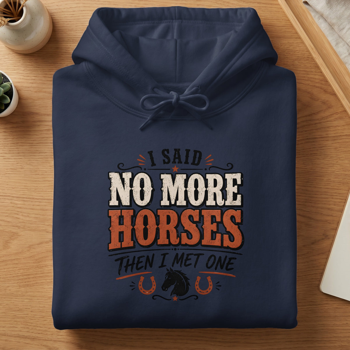Navy hoodie with "I said no more horses then I met one" text and horse graphic.
