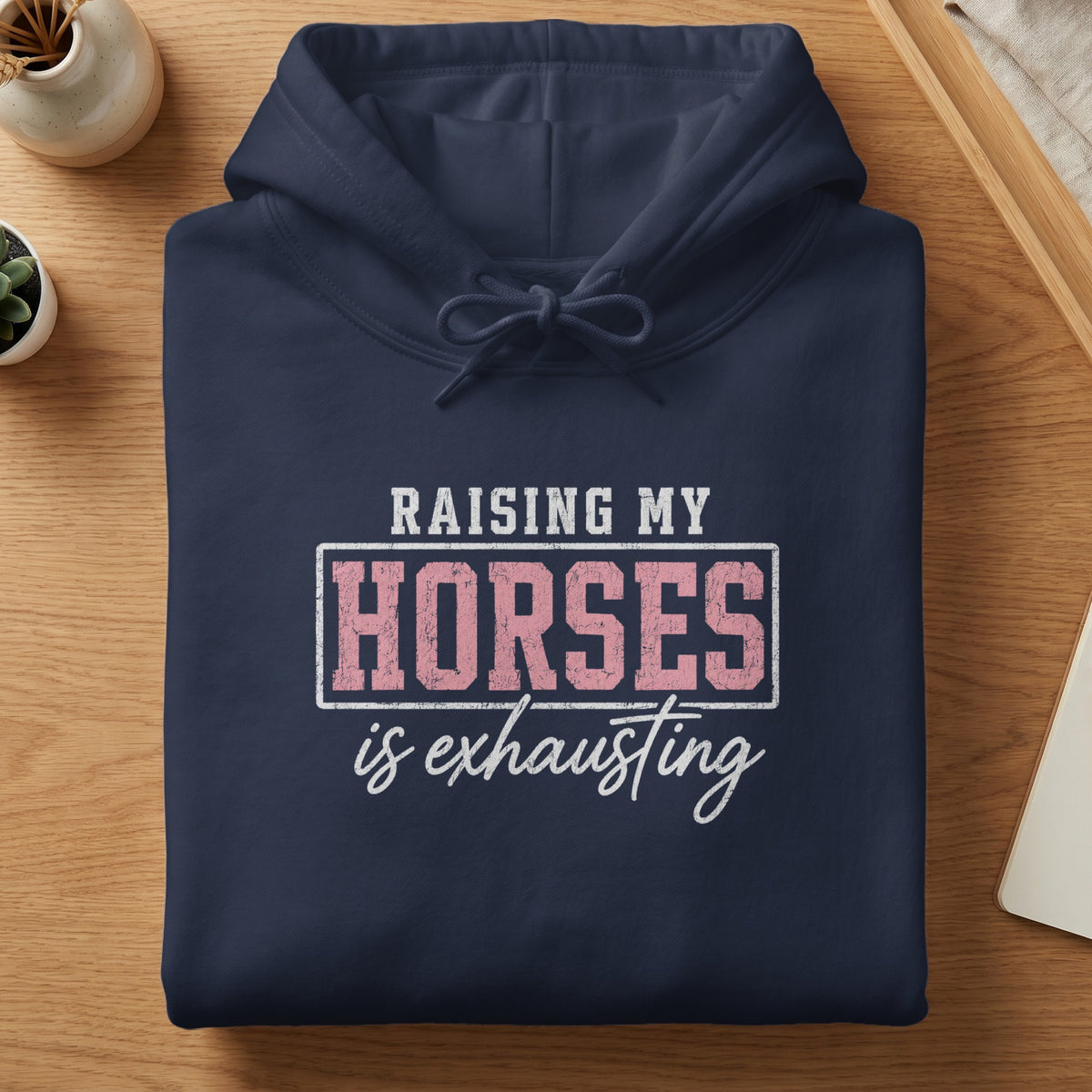 Navy blue hoodie with "Raising My Horses is Exhausting" graphic.